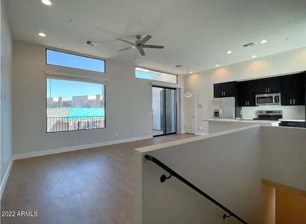 a kitchen with stainless steel appliances a refrigerator sink and stove