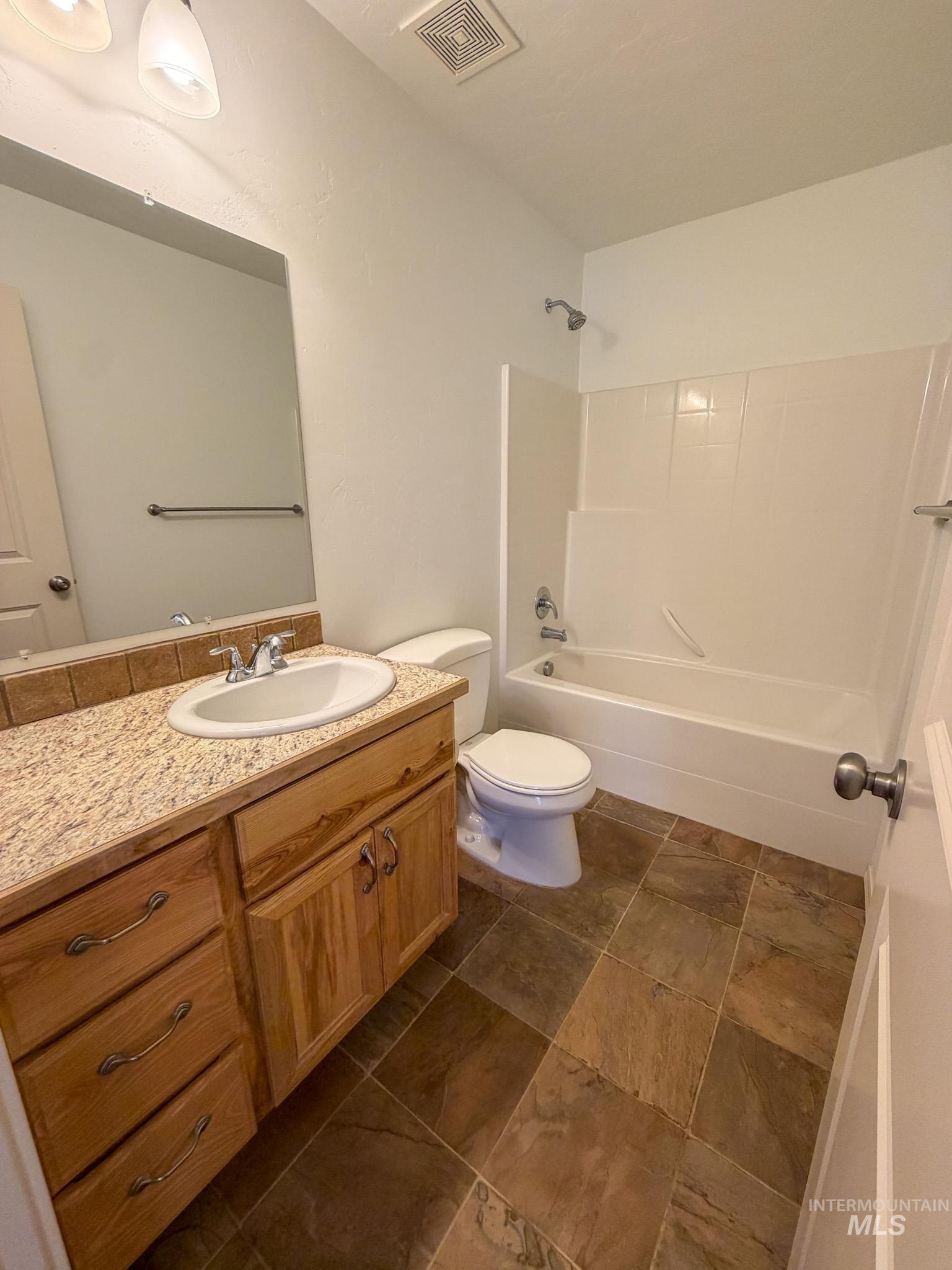 702 Emerald Street Rupert, ID 83350 - Photo 7 of 12 Bathroom featuring shower / tub combination and vanity