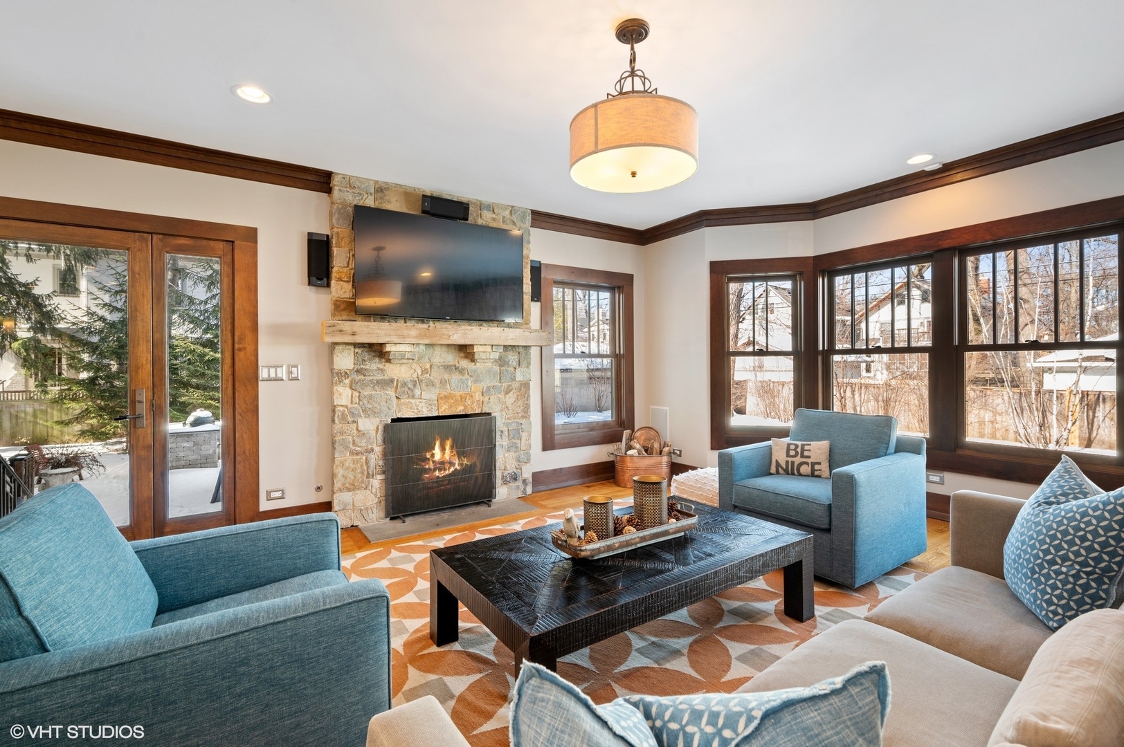 412 Central Avenue Wilmette, IL 60091 - Photo 18 of 69 a living room with furniture a flat screen tv and a fireplace