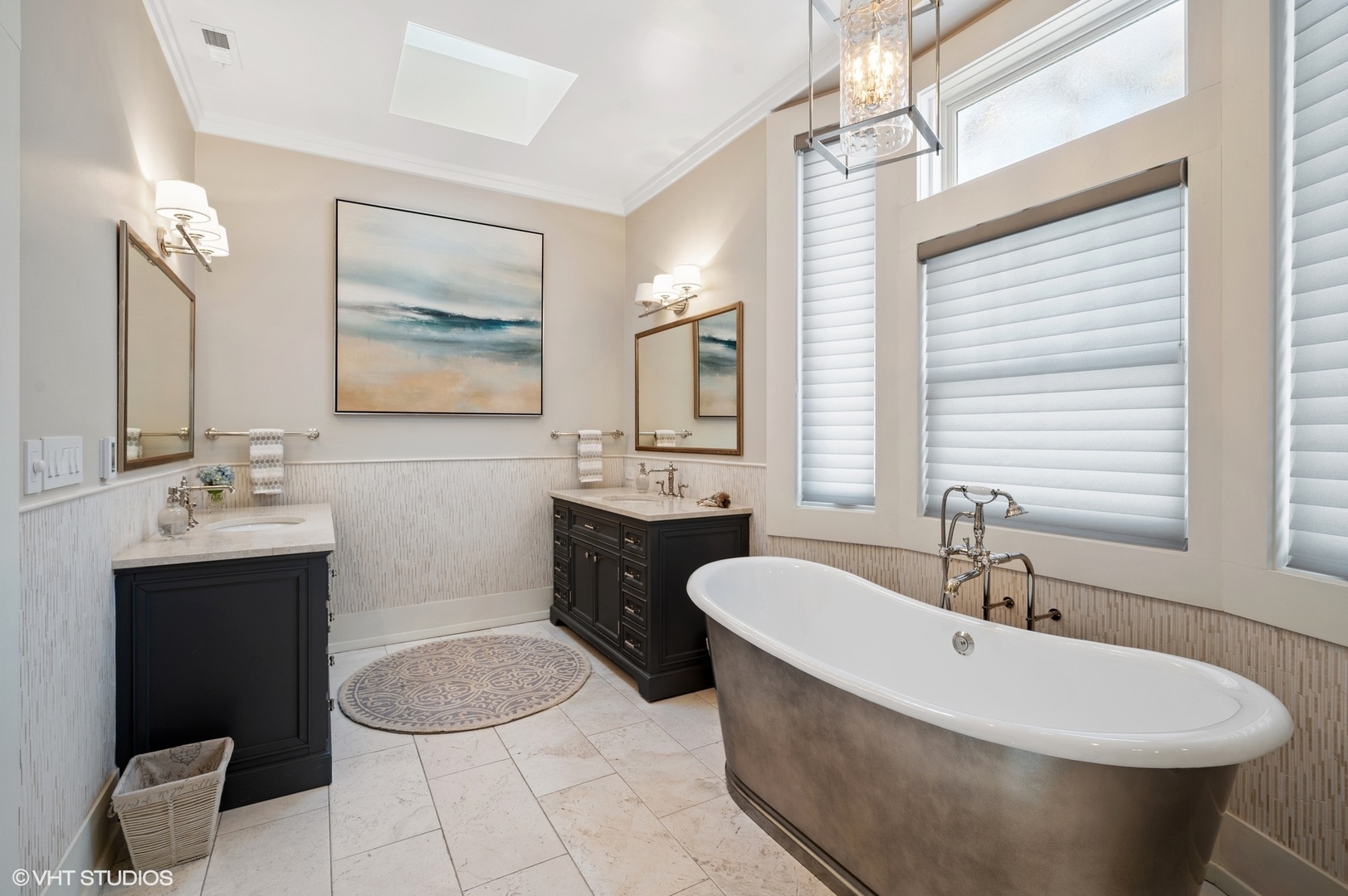412 Central Avenue Wilmette, IL 60091 - Photo 29 of 69 a bathroom with a bathtub sink and mirror