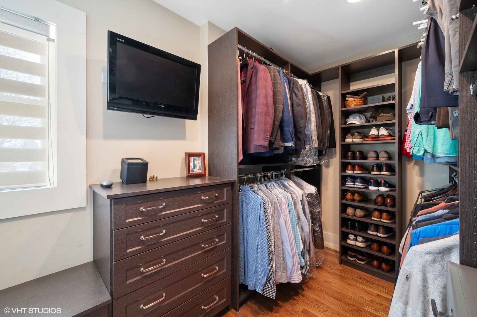 412 Central Avenue Wilmette, IL 60091 - Photo 31 of 69 a view of walk in closet with clothes and shoes