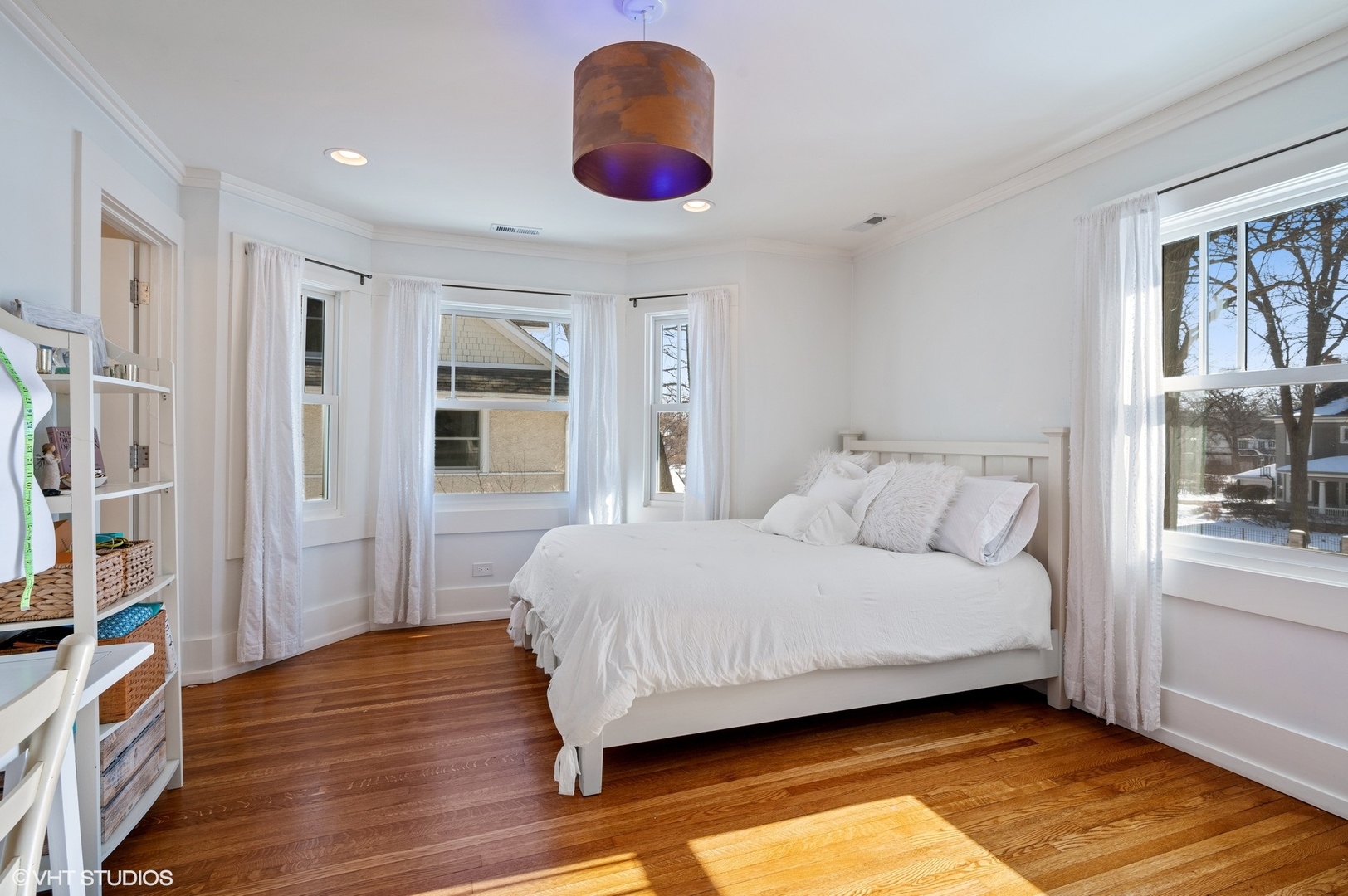 412 Central Avenue Wilmette, IL 60091 - Photo 33 of 69 a bedroom with a large bed chandelier and a window