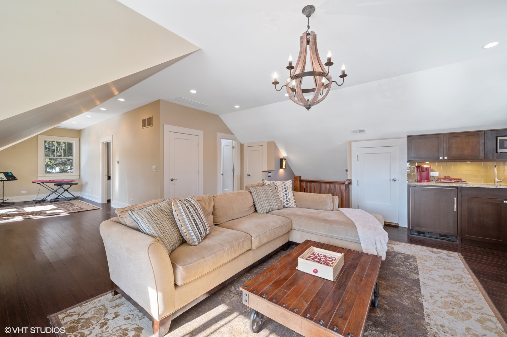 412 Central Avenue Wilmette, IL 60091 - Photo 43 of 69 a living room with furniture and a chandelier
