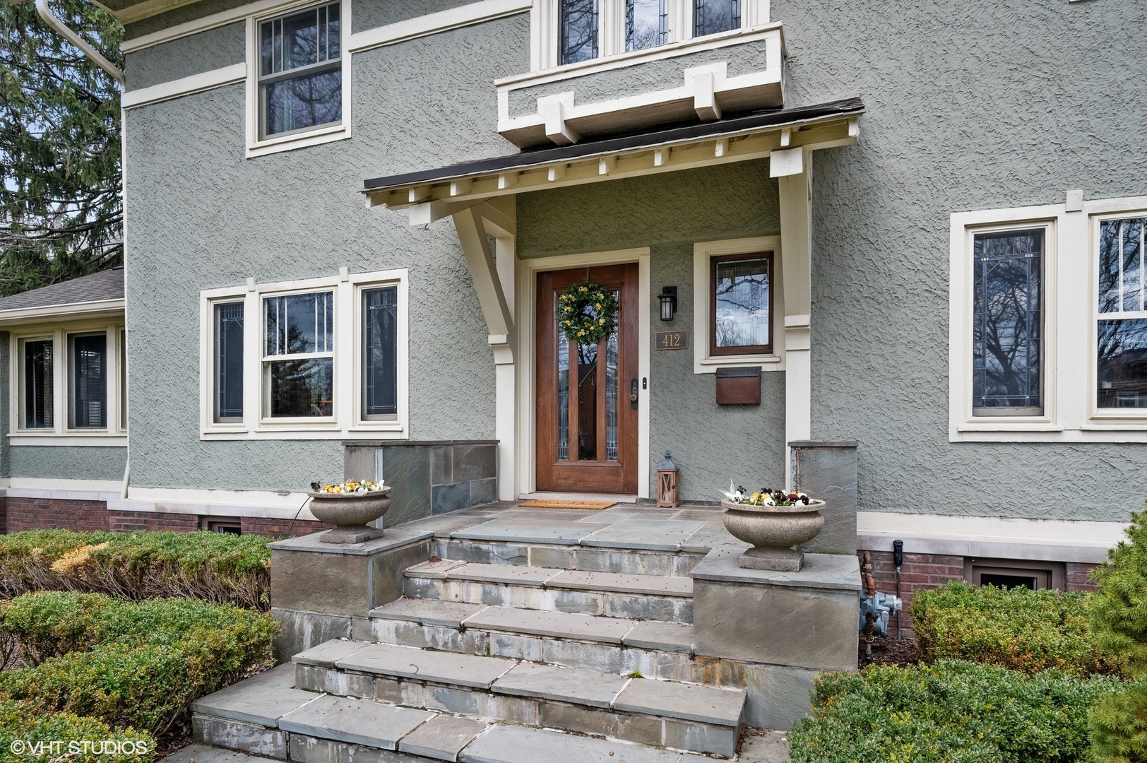 412 Central Avenue Wilmette, IL 60091 - Photo 7 of 69 a front view of a house with a yard