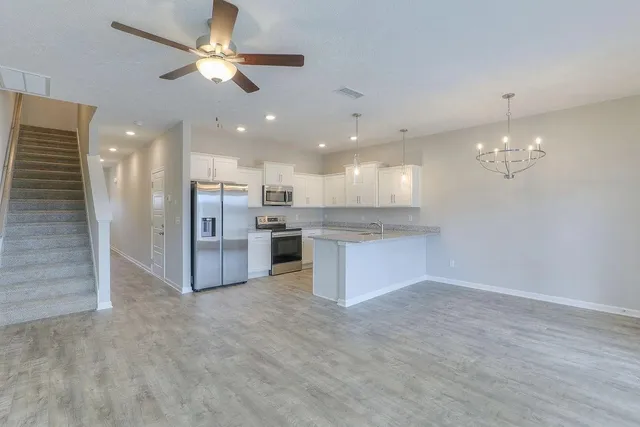 a view of a kitchen and chandelier a kitchen