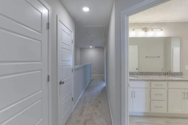 a view of bathroom with mirror