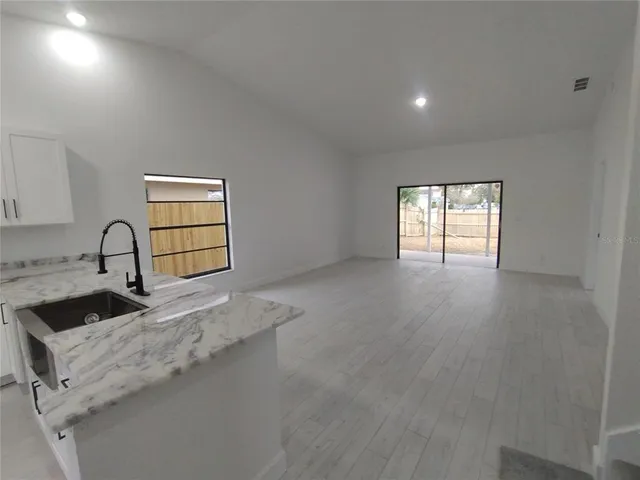 a view of a kitchen with a sink and dishwasher
