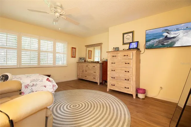 a bedroom with a bed and a closet