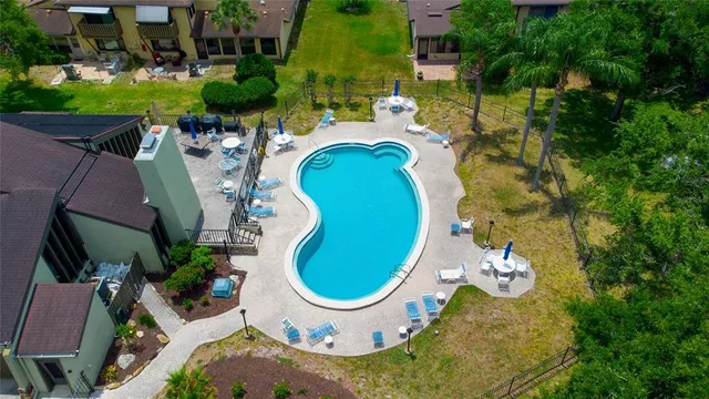 a view of a swimming pool with a patio