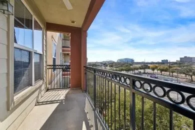 a view of a balcony with furniture