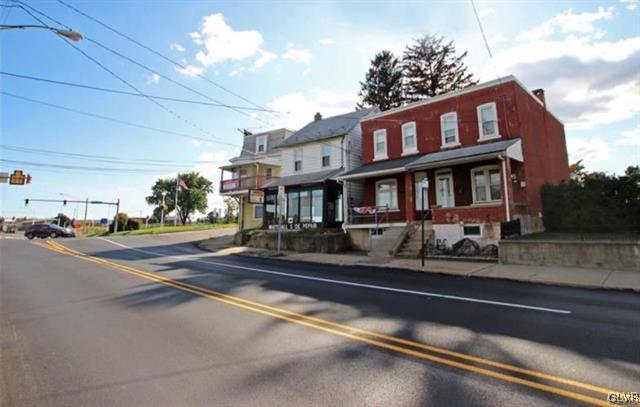 764 3rd Street Whitehall, PA 18052 - Photo 1 of 3 a front view of a house with a yard and street view