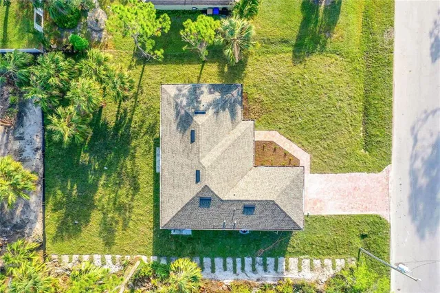 a large kitchen with cabinets wooden floor and stainless steel appliances