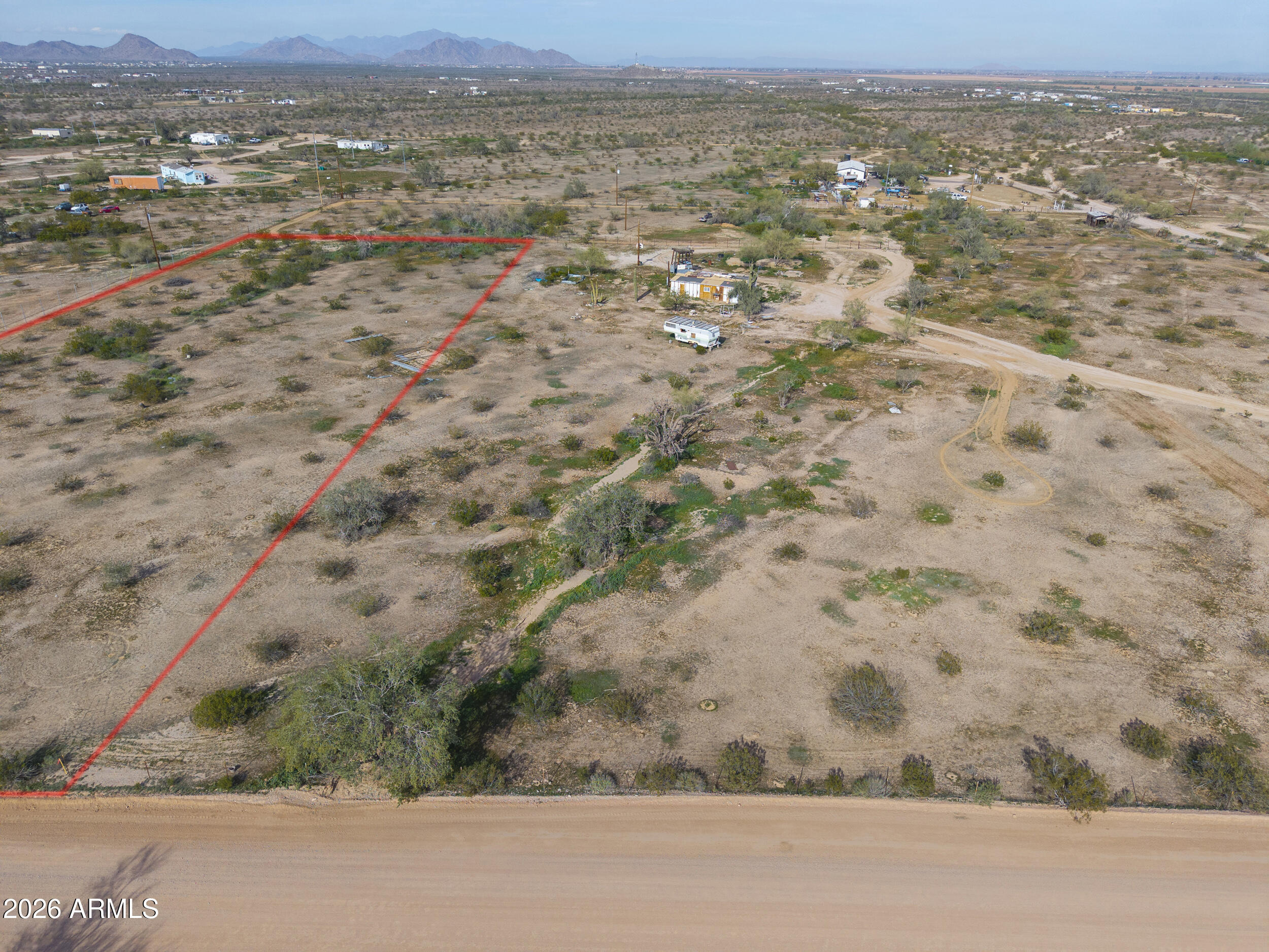 3290 North Ralston Road, Unit E Maricopa, AZ 85139 - Photo 3 of 11 an aerial view of residential houses with outdoor space