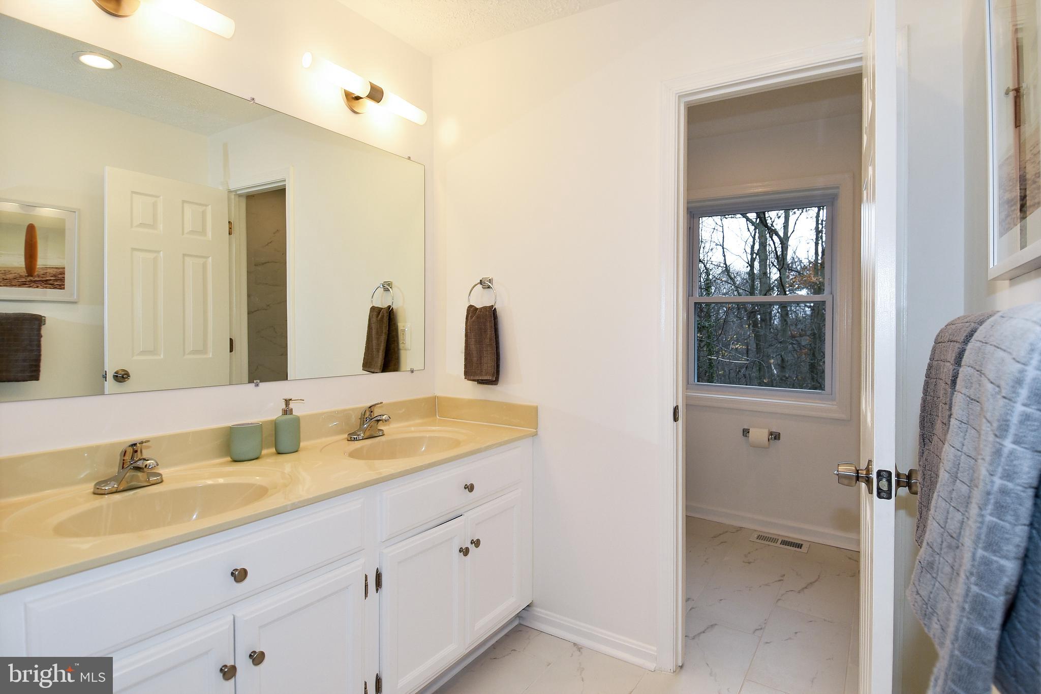 6441 Forest Road Cheverly, MD 20785 - Photo 34 of 45 Bathroom 2 with separate toilet & tub - Hallway