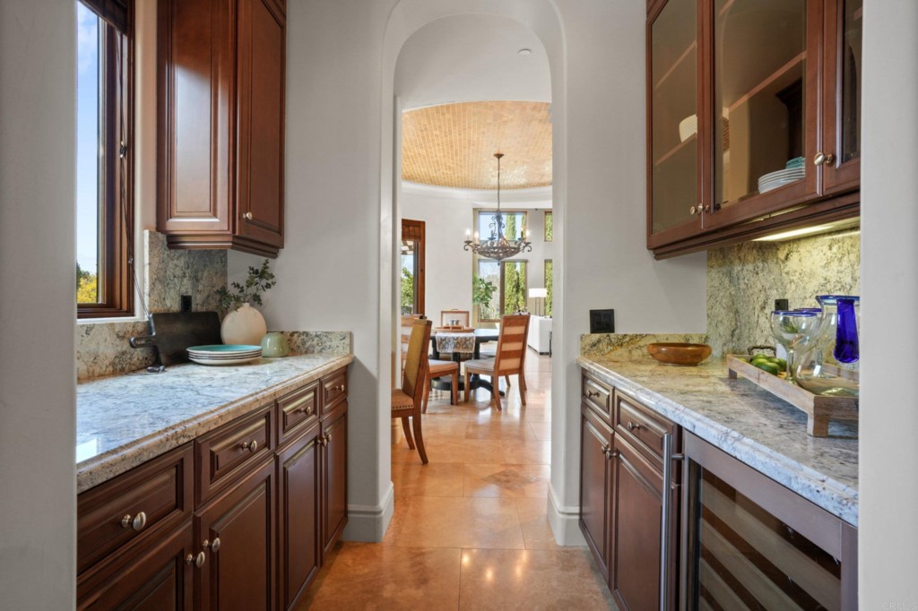 4205 Bridlewood Road Fallbrook, CA 92028 - Photo 12 of 59 a kitchen with stainless steel appliances granite countertop a stove a sink and a microwave