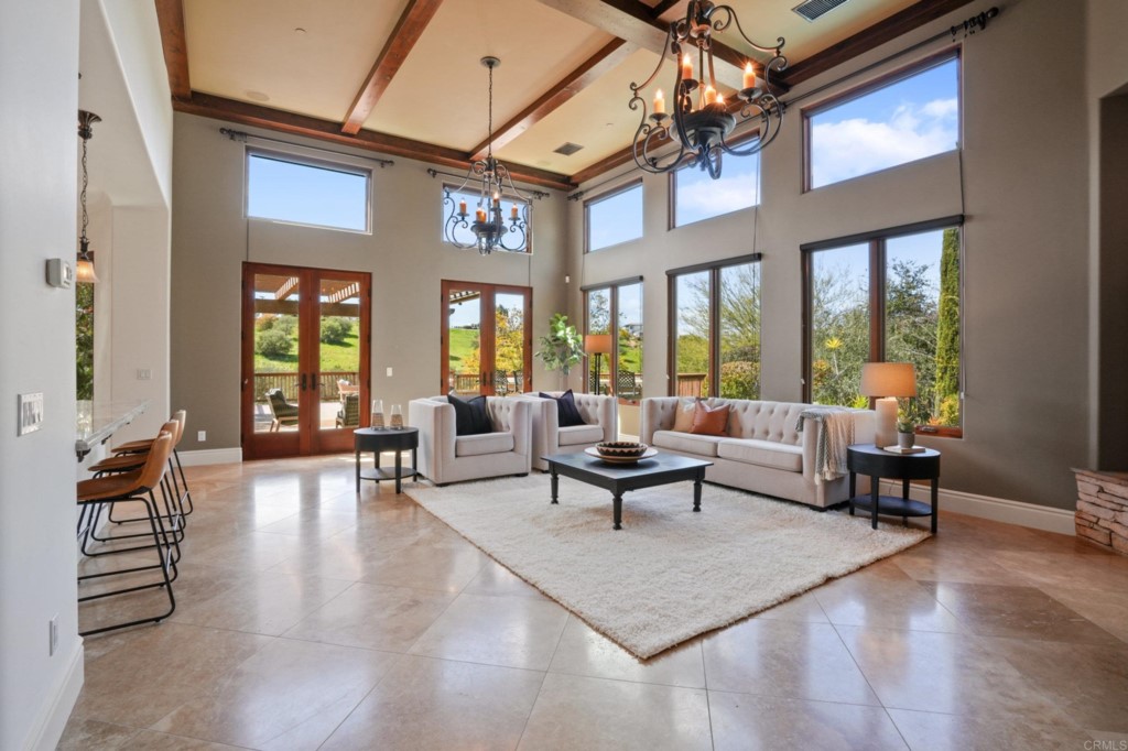 4205 Bridlewood Road Fallbrook, CA 92028 - Photo 13 of 59 a living room with furniture a fireplace and large windows