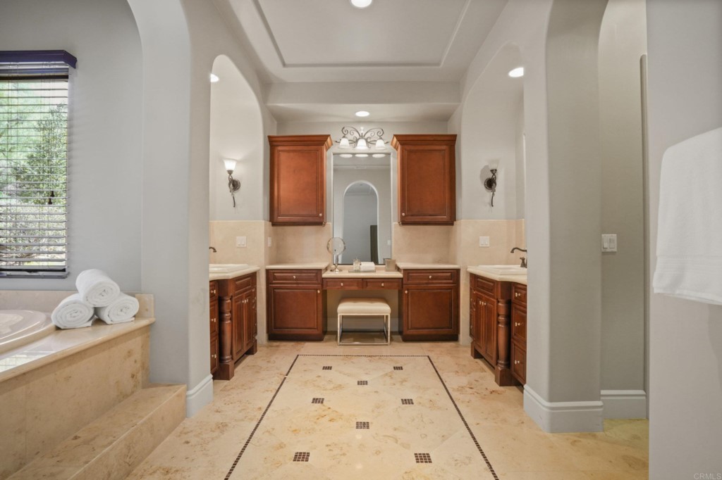 4205 Bridlewood Road Fallbrook, CA 92028 - Photo 21 of 59 a large bathroom with a tub sink and glass door