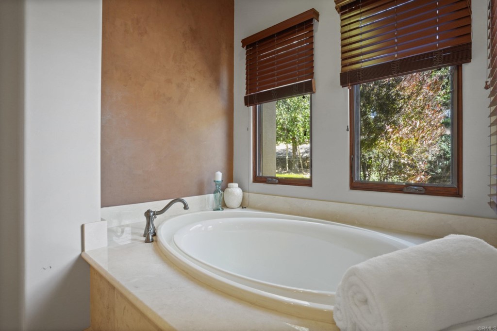 4205 Bridlewood Road Fallbrook, CA 92028 - Photo 22 of 59 a bath tub sitting in a bathroom next to a window