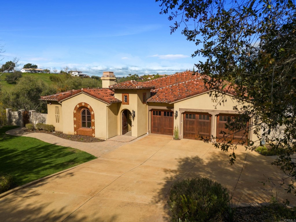 4205 Bridlewood Road Fallbrook, CA 92028 - Photo 59 of 59 a view of a white house with a yard