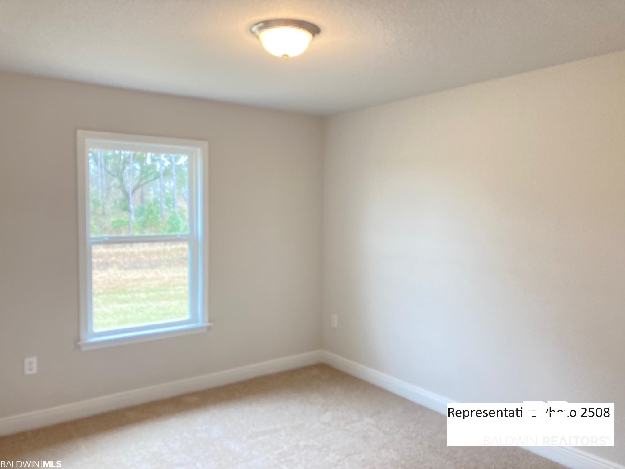 2201 Pollard Road Daphne, AL 36526 - Photo 12 of 15 Unfurnished room with carpet and plenty of natural light