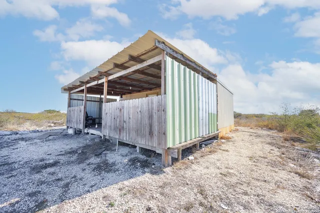 a view of a backyard of the house