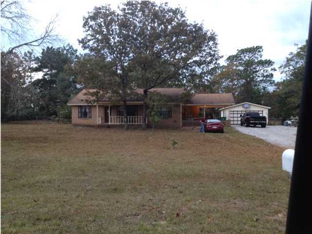 6274 Possum Ridge Road Crestview, FL 32539 - Photo 1 of 1 a view of house with truck parked in front of house