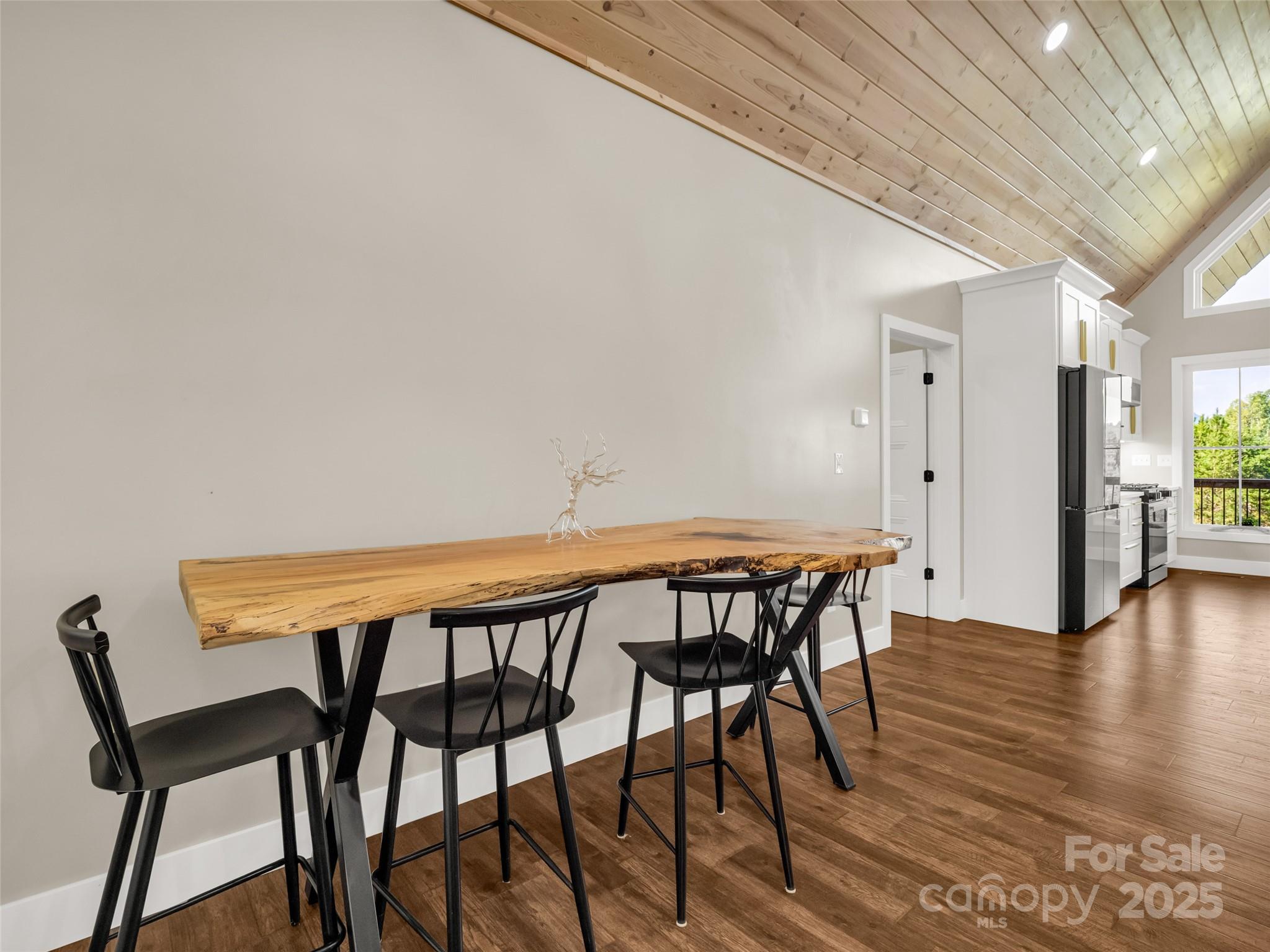 110 Geebees Way Mill Spring, NC 28756 - Photo 13 of 48 a view of a dining room with furniture and wooden floor