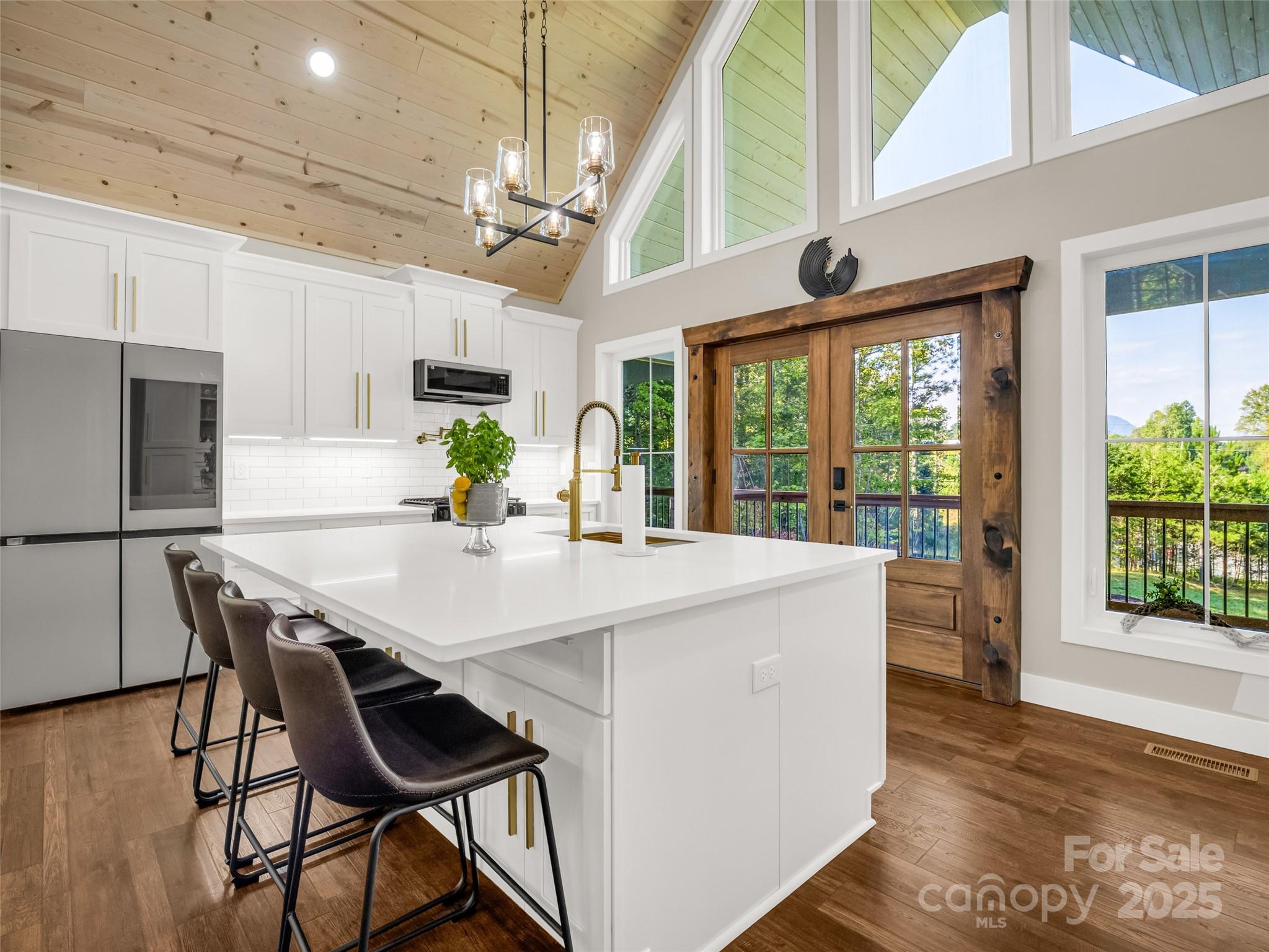110 Geebees Way Mill Spring, NC 28756 - Photo 15 of 48 a view of a dining room with furniture window and wooden floor