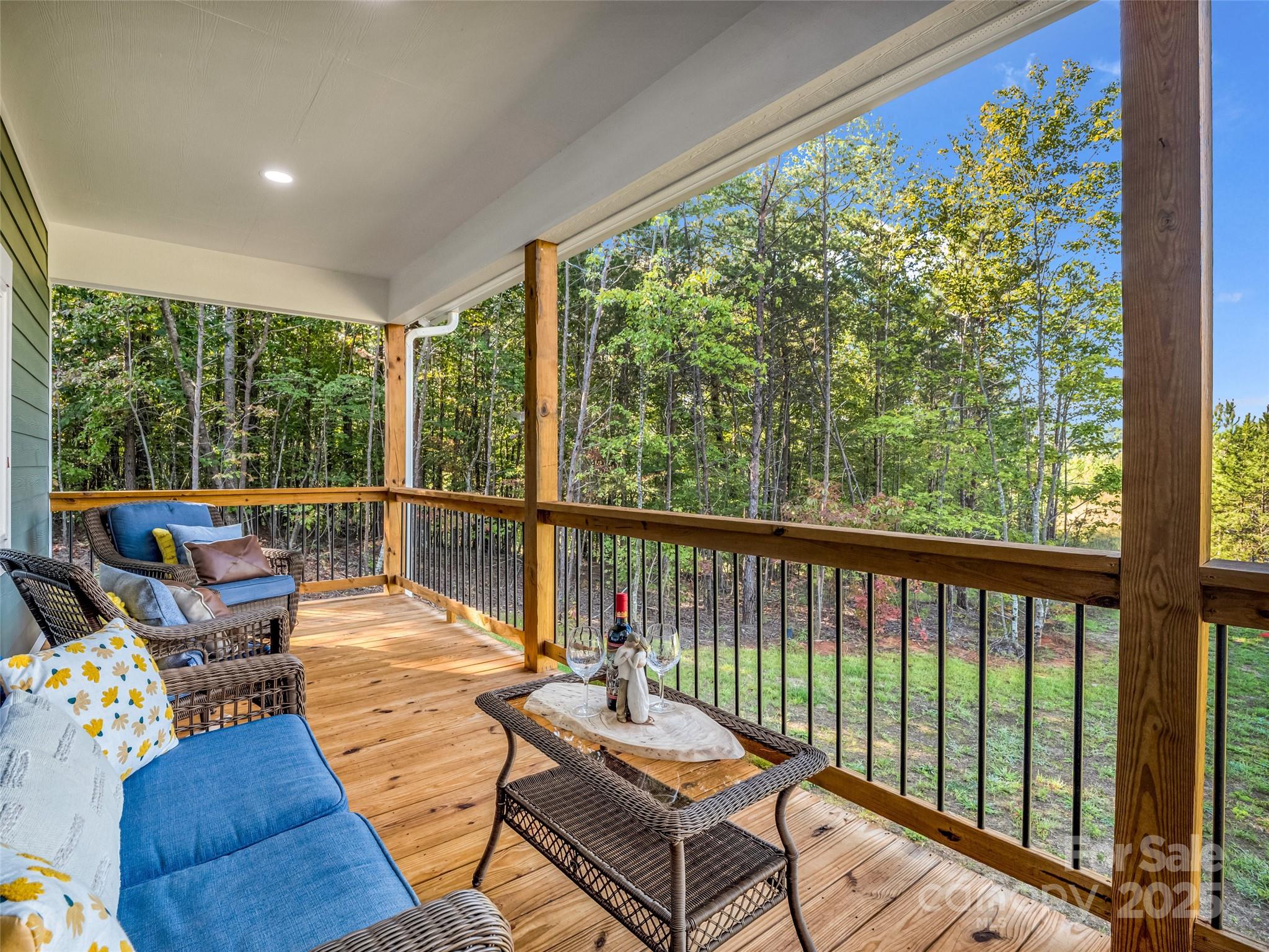 110 Geebees Way Mill Spring, NC 28756 - Photo 18 of 48 a balcony with furniture and wooden floor
