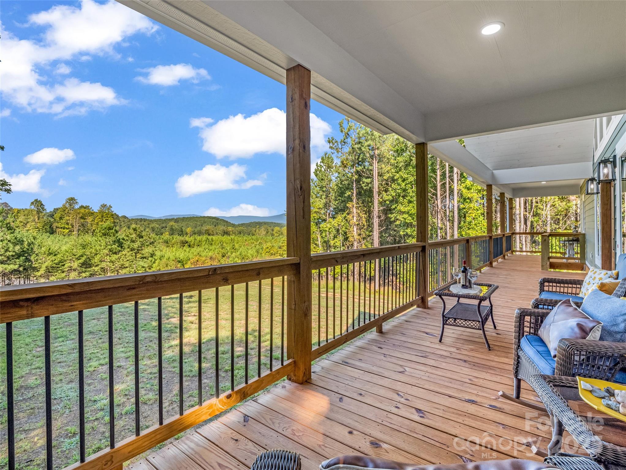 110 Geebees Way Mill Spring, NC 28756 - Photo 19 of 48 a view of a balcony with wooden floor
