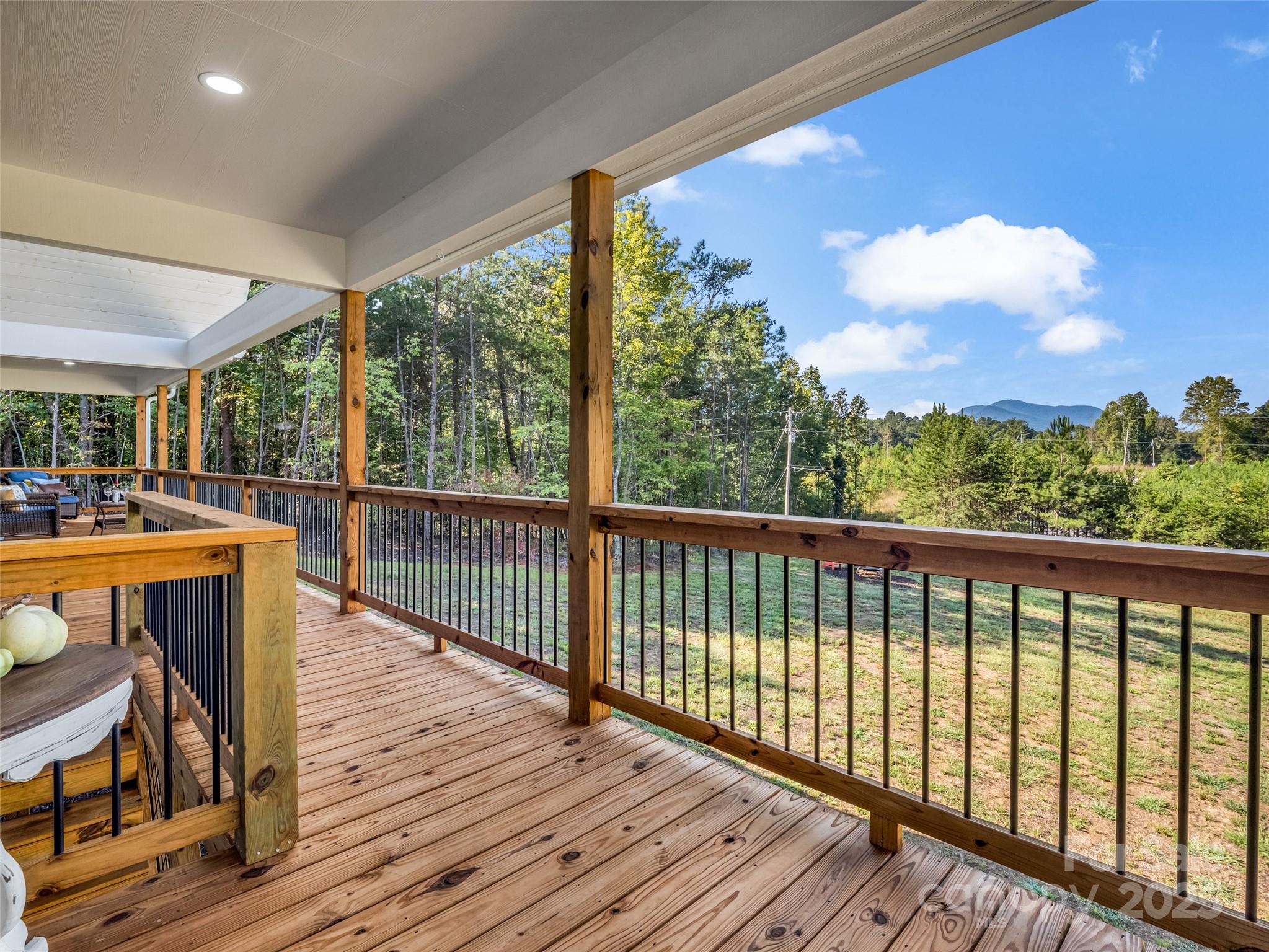 110 Geebees Way Mill Spring, NC 28756 - Photo 20 of 48 a view of balcony with wooden floor & fence