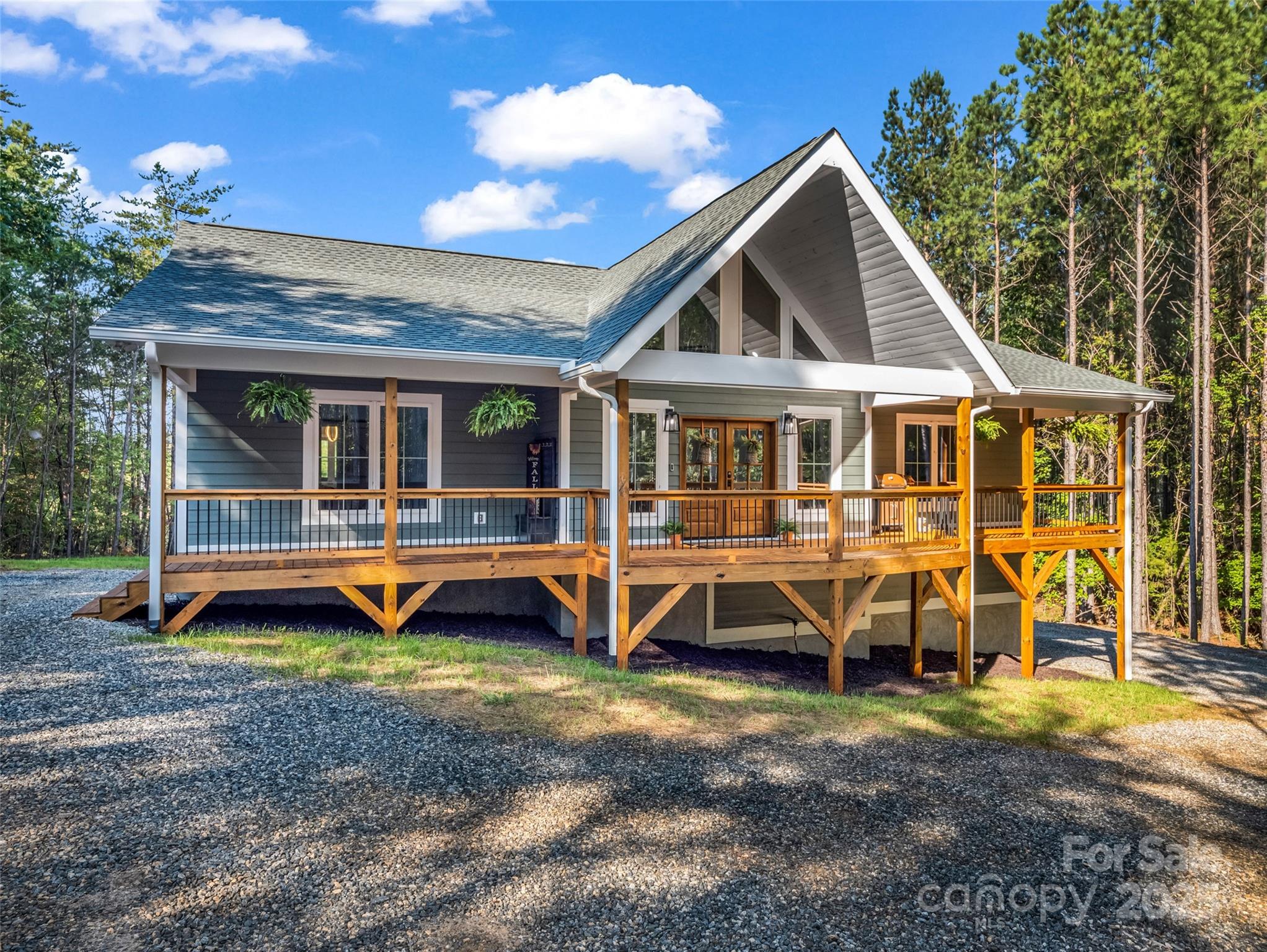 110 Geebees Way Mill Spring, NC 28756 - Photo 2 of 48 a view of a house with roof deck