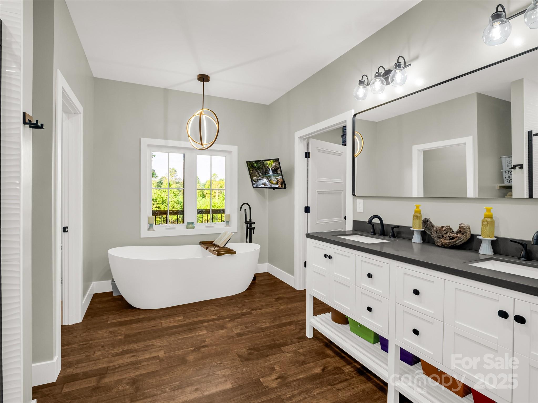 110 Geebees Way Mill Spring, NC 28756 - Photo 25 of 48 a bathroom with a sink and a mirror
