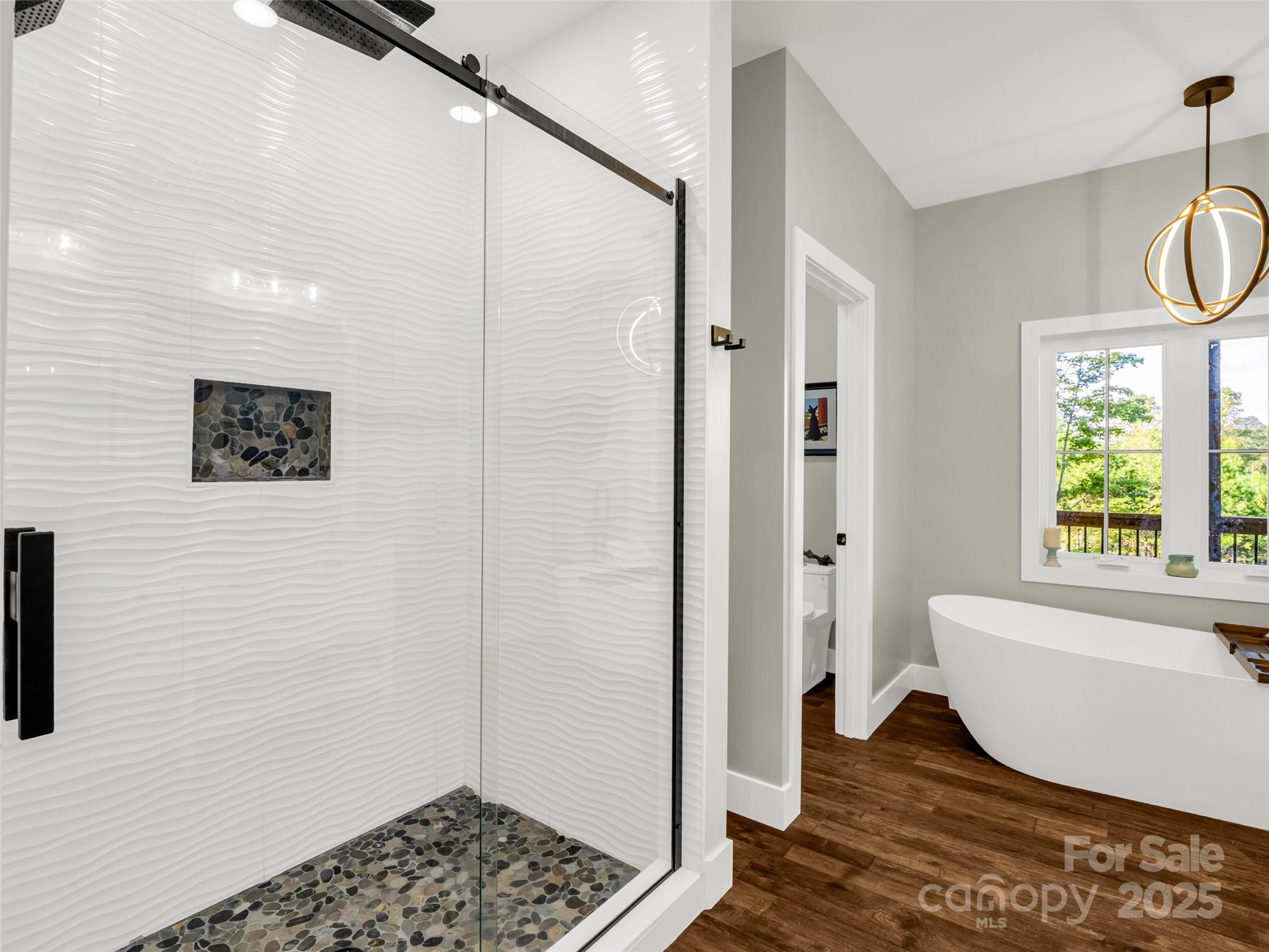 110 Geebees Way Mill Spring, NC 28756 - Photo 26 of 48 a bathroom with a bathtub and shower