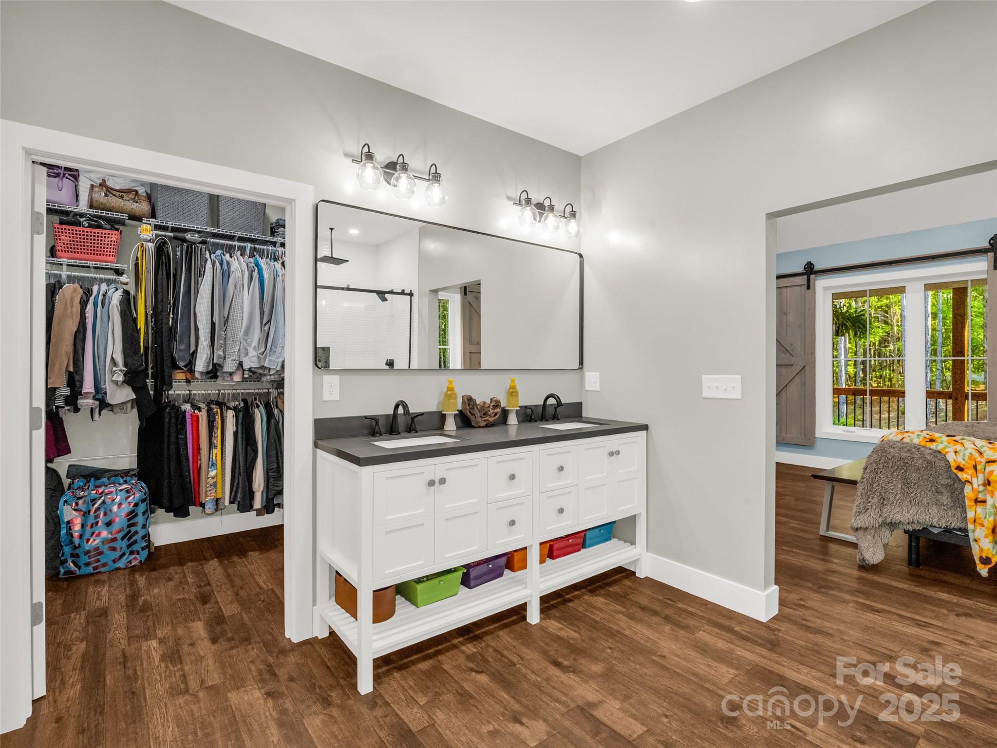110 Geebees Way Mill Spring, NC 28756 - Photo 28 of 48 a view of walk in closet with clothes and shoes