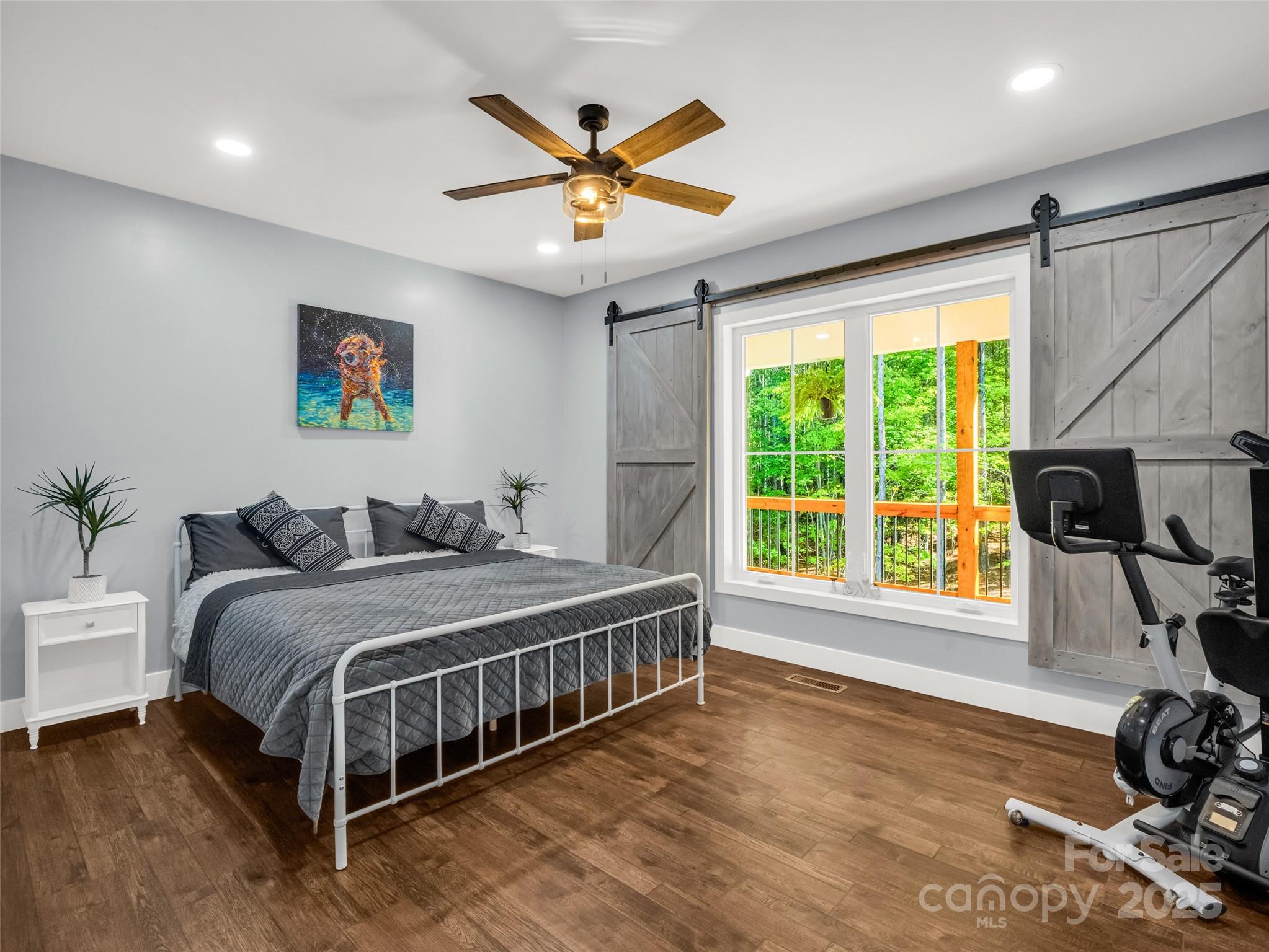 110 Geebees Way Mill Spring, NC 28756 - Photo 29 of 48 a bed room with a bed and a large window