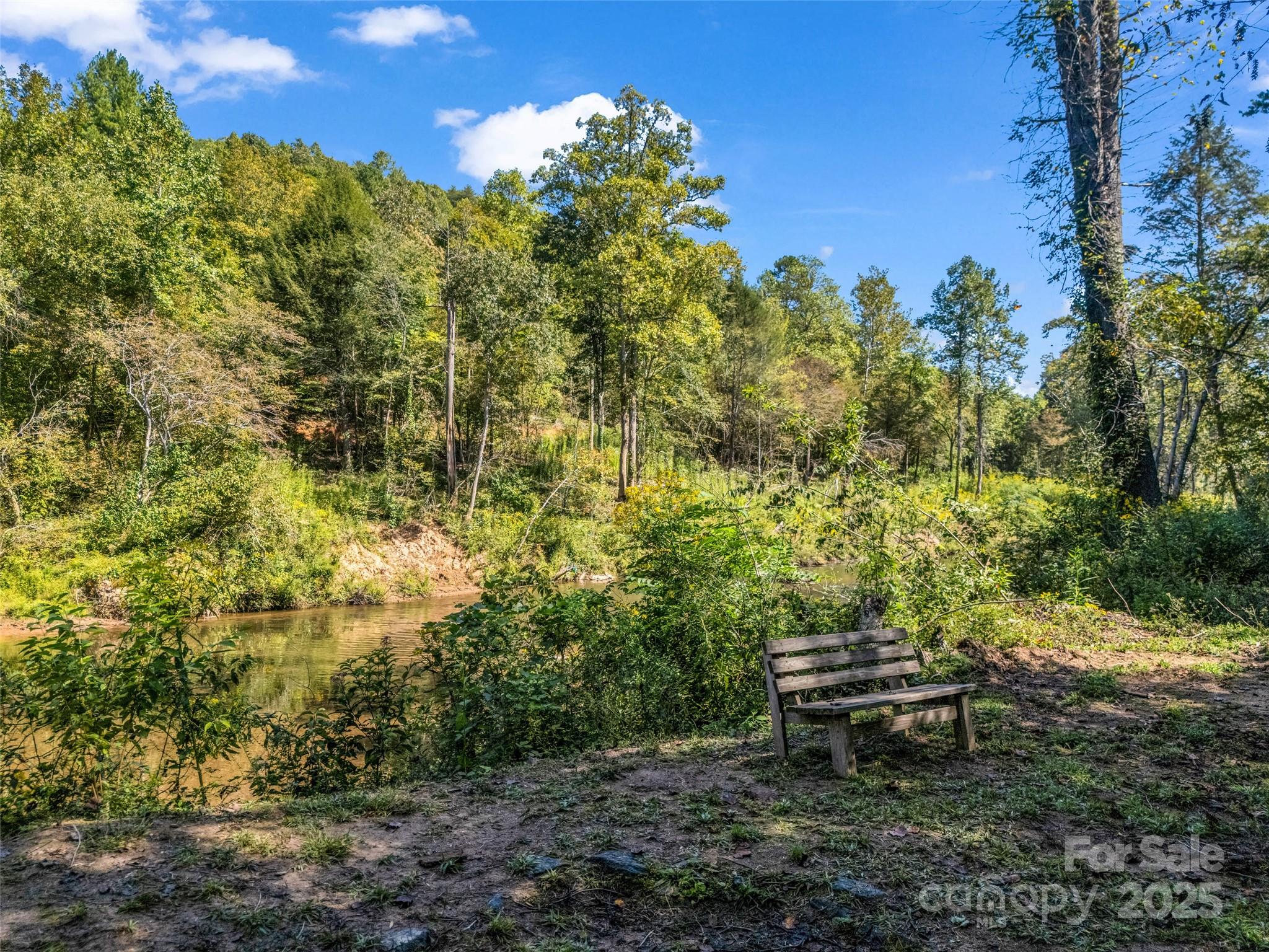 110 Geebees Way Mill Spring, NC 28756 - Photo 47 of 48 a view of a bench in a garden