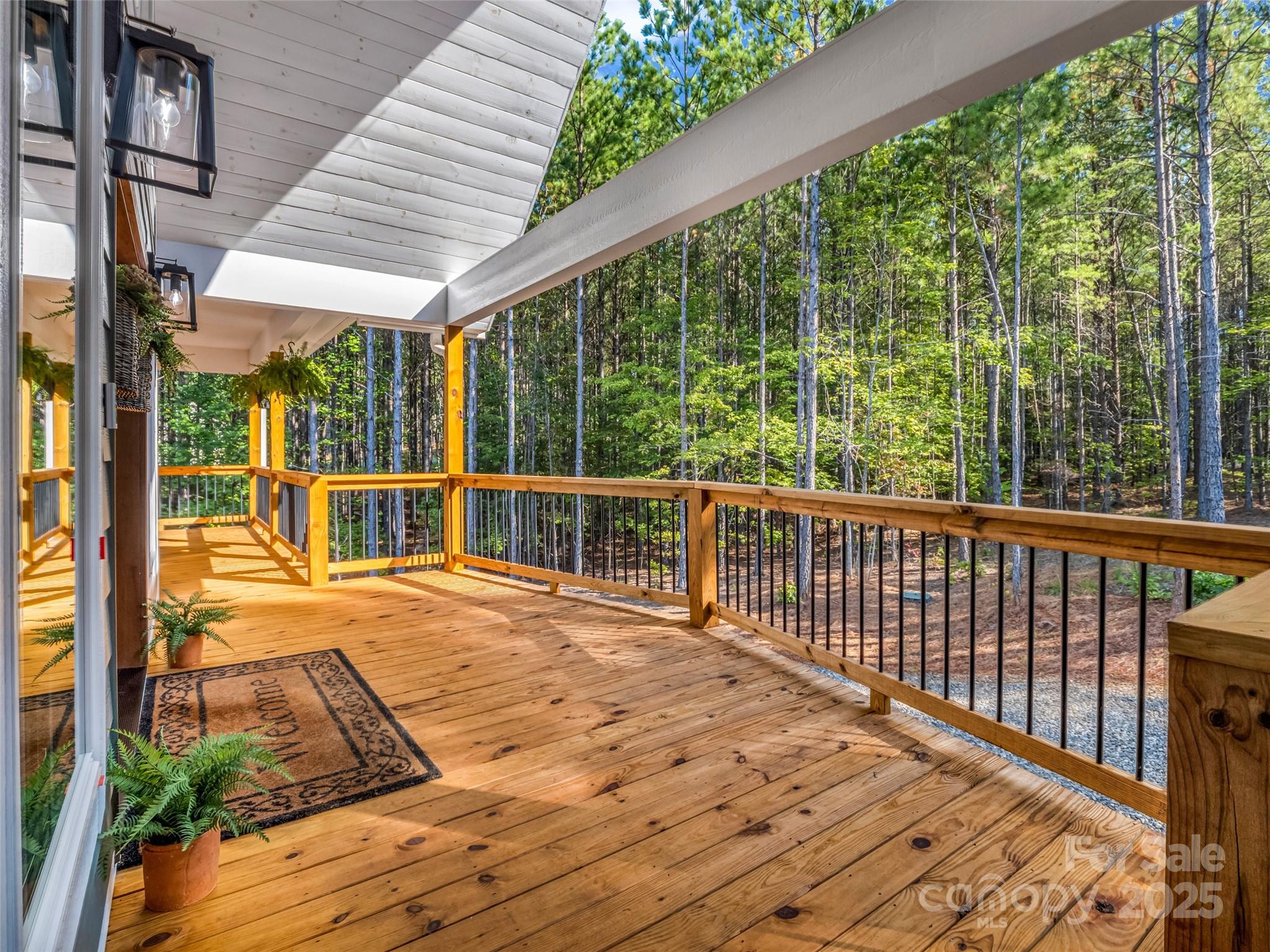110 Geebees Way Mill Spring, NC 28756 - Photo 8 of 48 a view of a balcony with wooden floor