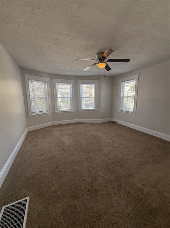 13 Sculpin Way, Unit 1 Swampscott, MA 01907 - Photo 7 of 9 a view of an empty room with window and stairs