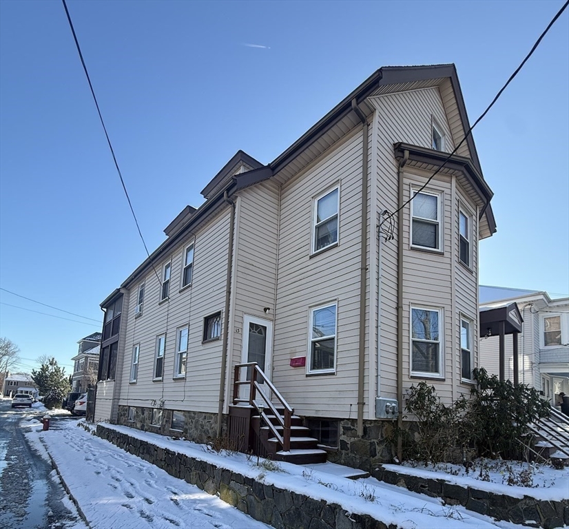 13 Sculpin Way, Unit 1 Swampscott, MA 01907 - Photo 9 of 9 a front view of a house with a yard