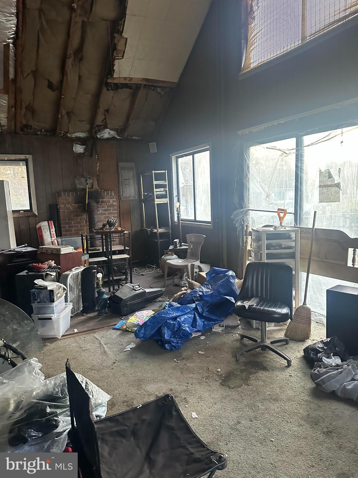 16122 Thoroughfare Road Haymarket, VA 20169 - Photo 16 of 34 a living room with furniture a fireplace and a large window