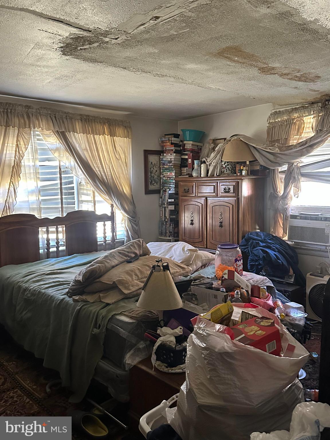 16122 Thoroughfare Road Haymarket, VA 20169 - Photo 24 of 34 a bed sitting in a bedroom next to a window
