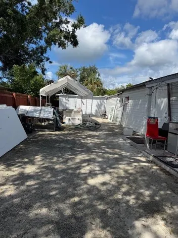 a front view of a house with sitting area