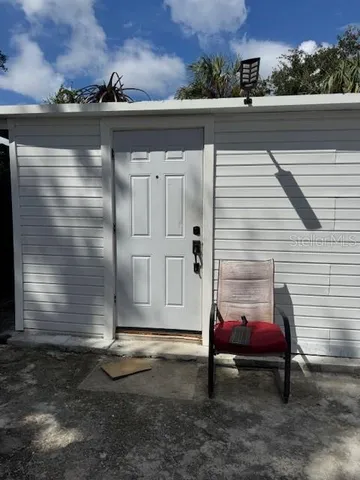a kitchen with a sink cabinets and a wooden floor