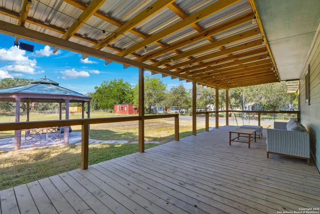 a view of swimming pool with seating space