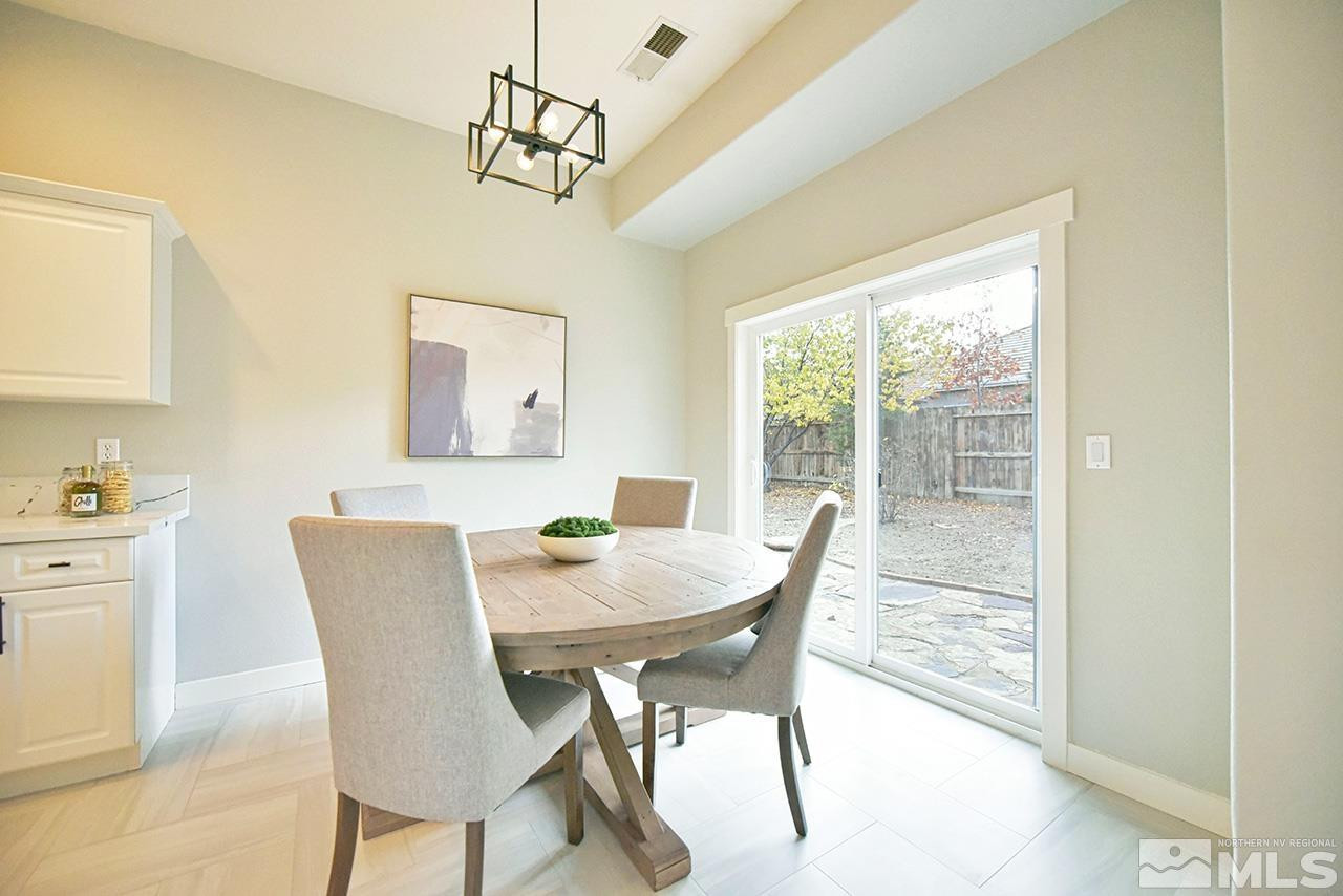 1680 Caliterra Way Reno, NV 89521 - Photo 13 of 34 a view of a dining room with furniture window and outside view