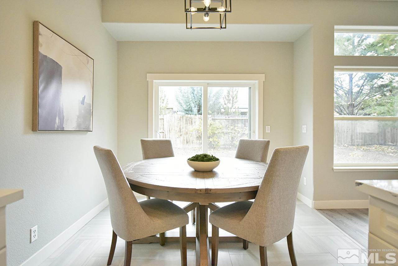 1680 Caliterra Way Reno, NV 89521 - Photo 14 of 34 a view of a dining room with a table and chairs