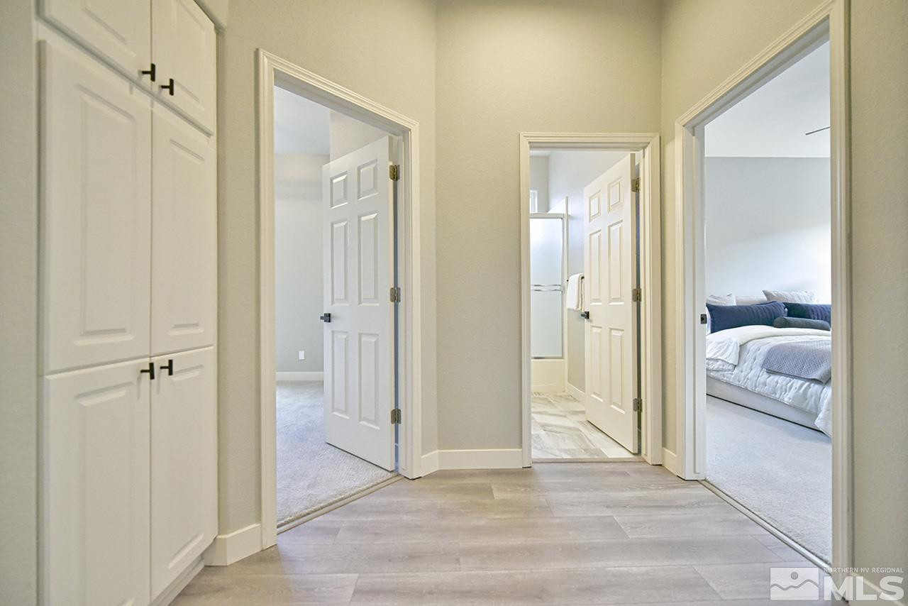 1680 Caliterra Way Reno, NV 89521 - Photo 20 of 34 a view of a bedroom from a hallway