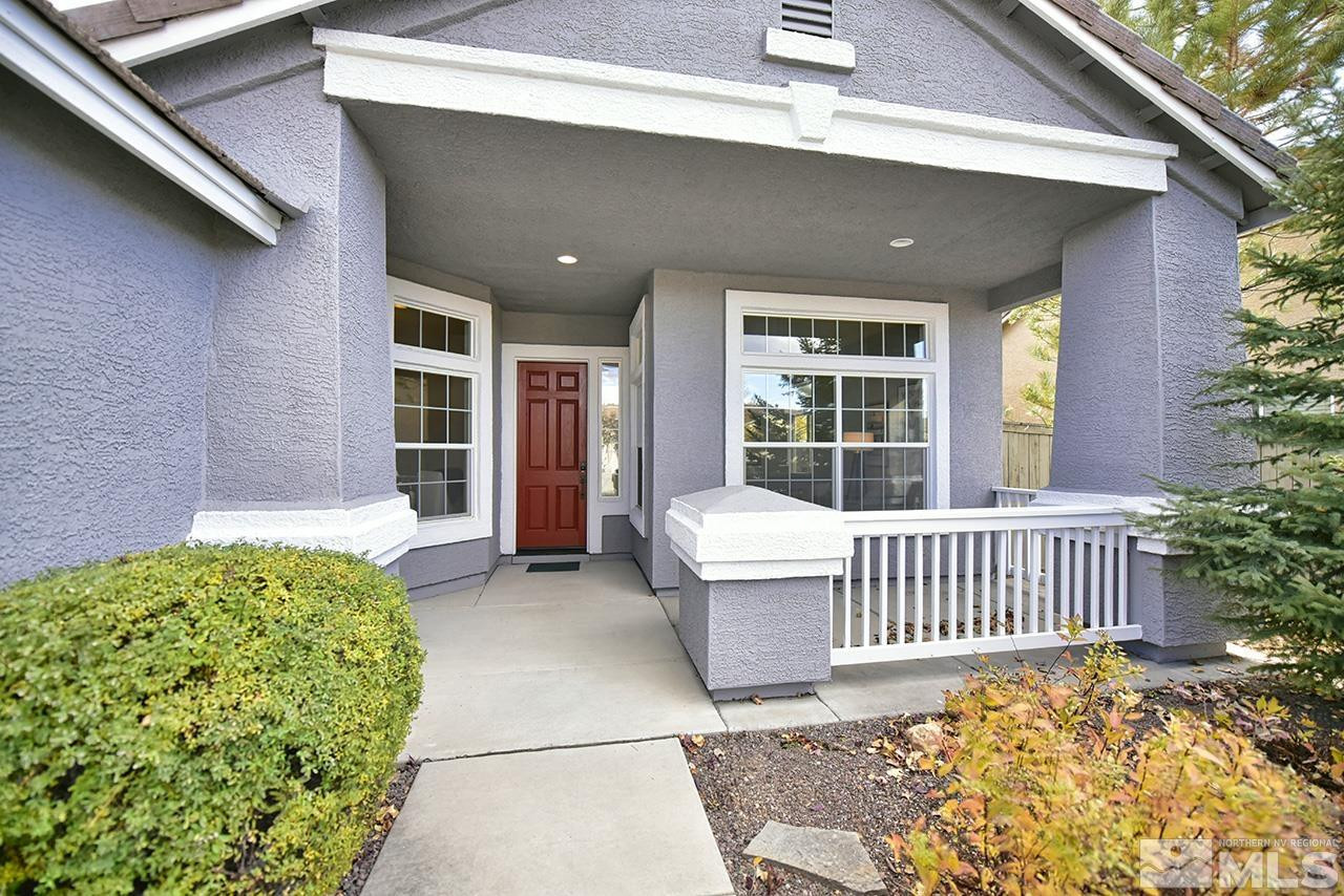 1680 Caliterra Way Reno, NV 89521 - Photo 2 of 34 a view of a house with a wooden fence