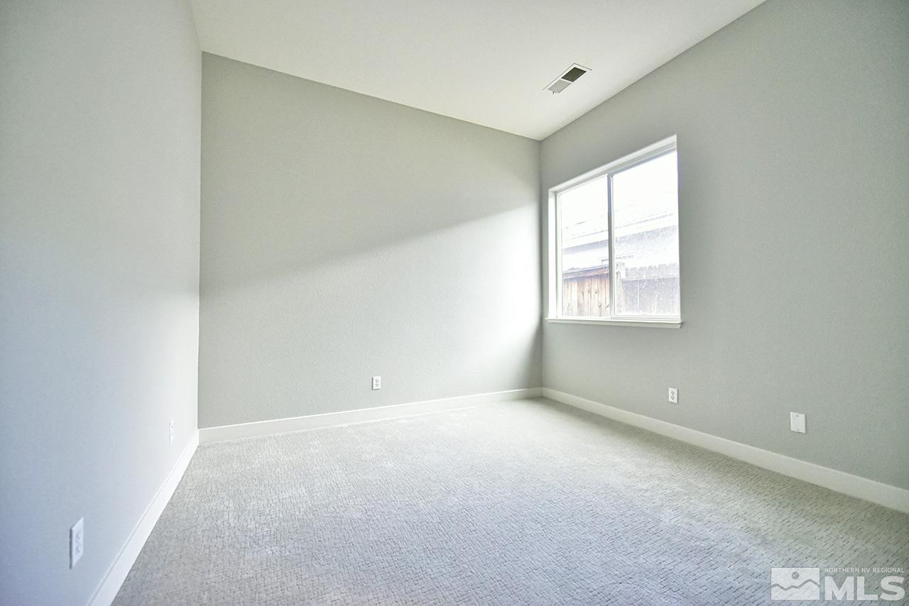 1680 Caliterra Way Reno, NV 89521 - Photo 21 of 34 an empty room with windows